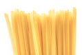 Traditional flat thin tagliatelle ribbons pattern, large detailed vertical isolated raw dry long uncooked egg pasta macro closeup Royalty Free Stock Photo