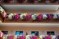 Traditional flowered balcony at the Alps, Austria. Royalty Free Stock Photo