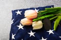 Traditional folded of America United States flag, tag and tulip flower Royalty Free Stock Photo