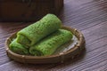 Kuih Dadar or Kuih Tayap Malaysian Pandan Crepes with Sweet Coconut Filling-Traditional food photography Royalty Free Stock Photo