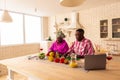 Pleasant nice African couple cooking lunch together Royalty Free Stock Photo