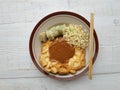 Traditional food from Surabaya, Indonesia made from tofu and egg, then poured with peanut sauce