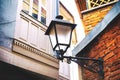 Traditional forged iron lamp on the street