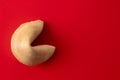 Traditional fortune cookie on red background Royalty Free Stock Photo