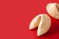 Traditional fortune cookie on red background