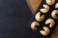 Traditional fortune cookies black slate background