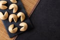 Traditional fortune cookies black slate background