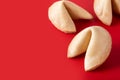 Traditional fortune cookies on red background