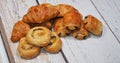 Traditional french butter croissant, Raisin Swirl and Chocolatine on wooden background Royalty Free Stock Photo