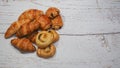 Traditional french butter croissant, Raisin Swirl and Chocolatine on wooden background Royalty Free Stock Photo