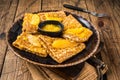 Traditional French crepe Suzette with orange sauce on a plate. Wooden background. Top view Royalty Free Stock Photo