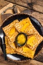 Traditional French crepe Suzette with orange sauce on a plate. Wooden background. Top view Royalty Free Stock Photo