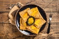 Traditional French crepe Suzette with orange sauce on a plate. Wooden background. Top view Royalty Free Stock Photo