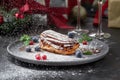 Traditional French dessert. Eclair with chocolate icing and custard. Dark background Royalty Free Stock Photo