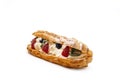 Traditional french dessert opened eclair with buttercream, fresh strawberries, icing sugar and mint on white Royalty Free Stock Photo