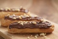 Traditional french eclairs with chocolate and hazelnuts Royalty Free Stock Photo