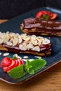 Traditional french eclairs with chocolate, menu food concept.