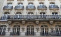 Traditional French house with typical balconies and windows. Paris. Royalty Free Stock Photo