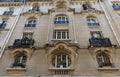Traditional French house with typical balconies and windows. Paris. Royalty Free Stock Photo