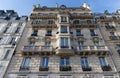 Traditional French house with typical balconies and windows. Paris . Royalty Free Stock Photo