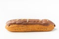 Traditional French pastry. Eclair with custard and chocolate icing isolated on white background. Eclair with cream filling covered Royalty Free Stock Photo