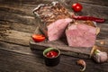 Traditional French Pate en croute with goose meat and liver as closeup on a wooden board Royalty Free Stock Photo