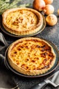 Traditional french pie. Quiche lorraine on kitchen table Royalty Free Stock Photo