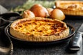 Traditional french pie. Quiche lorraine on kitchen table Royalty Free Stock Photo