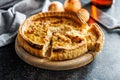 Traditional french pie. Quiche lorraine on kitchen table Royalty Free Stock Photo