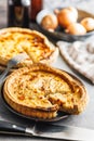 Traditional french pie. Quiche lorraine on kitchen table Royalty Free Stock Photo