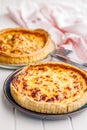 Traditional french pie. Quiche lorraine on white table Royalty Free Stock Photo