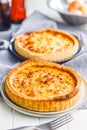 Traditional french pie. Quiche lorraine on white table Royalty Free Stock Photo