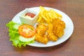 Traditional French potato fries with tomato salad ketchup and ma