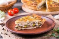 Traditional french quiche pie with chicken and mushroom on the wooden table Royalty Free Stock Photo