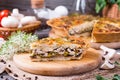 Traditional french quiche pie with chicken and mushroom on the wooden table Royalty Free Stock Photo