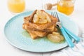 Traditional French toasts for breakfast with caramelized apples