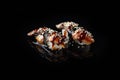 Traditional fresh Delicious Unagi Eel Nigiri Sushi Eel Sushi on a black background with reflection. Traditional Japanese