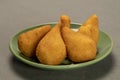 traditional fried coxinha in plate on slate background, popular brazilian snack Royalty Free Stock Photo