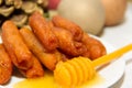 Traditional fried pestiÃÂ±os with honey and anise prepared for Christmas and Easter in Spain