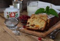 Traditional fruitcake with raisins, dried apricots, cherry for Christmas on wooden background. Sliced freshly baked cake Royalty Free Stock Photo