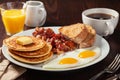 Traditional full american breakfast eggs pancakes with bacon and toast Royalty Free Stock Photo