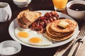 traditional full american breakfast eggs pancakes with bacon and toast Royalty Free Stock Photo