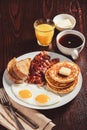 traditional full american breakfast eggs pancakes with bacon and toast Royalty Free Stock Photo