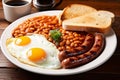 Traditional full English breakfast with baked beans, fried egg, sausage and bread