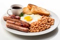 Traditional full English breakfast with fried eggs, sausages, beans, grilled tomatoes and bacon. AI Generated Royalty Free Stock Photo