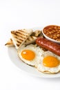 Traditional full English breakfast with fried eggs, sausages, beans, mushrooms, grilled tomatoes and bacon Royalty Free Stock Photo