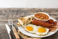 Traditional full English breakfast with fried eggs, sausages, beans, mushrooms, grilled tomatoes and bacon Royalty Free Stock Photo