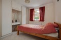 Traditional furnished bedroom with fitted wardrobe