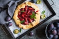 Traditional Galette pie filled with plums