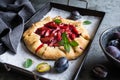 Traditional Galette pie filled with plums